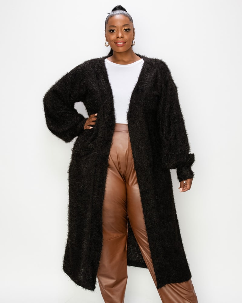 Front of a model wearing a plus size Feather Bishop Sleeve Pocket Cardigan in Black by L I V D. | dia_product_style_image_id:240201